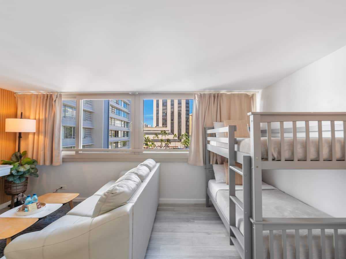 Bunk nook and sleeper sofa viewed from the television wall