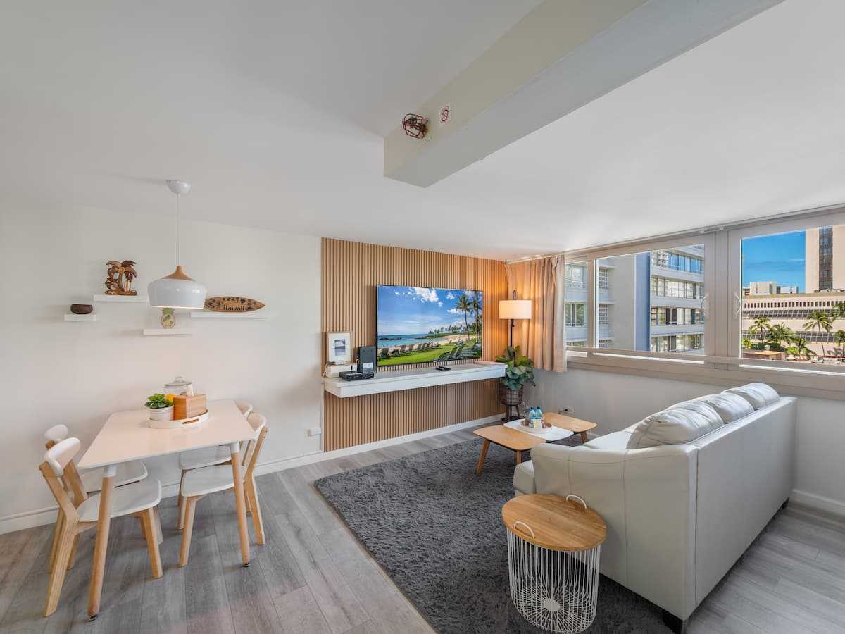 Dining area and sleeper sofa beside the corner windows