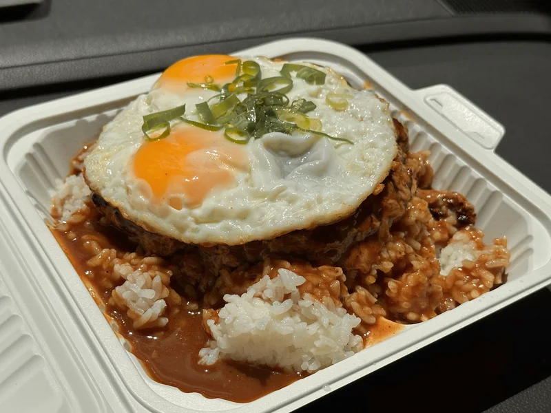 Loco moco with fried eggs and brown gravy over rice.